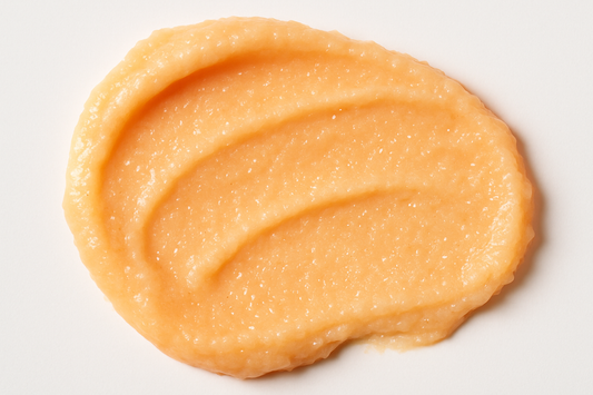 create a swatch of a creamy pastel orange sugar body scrub
