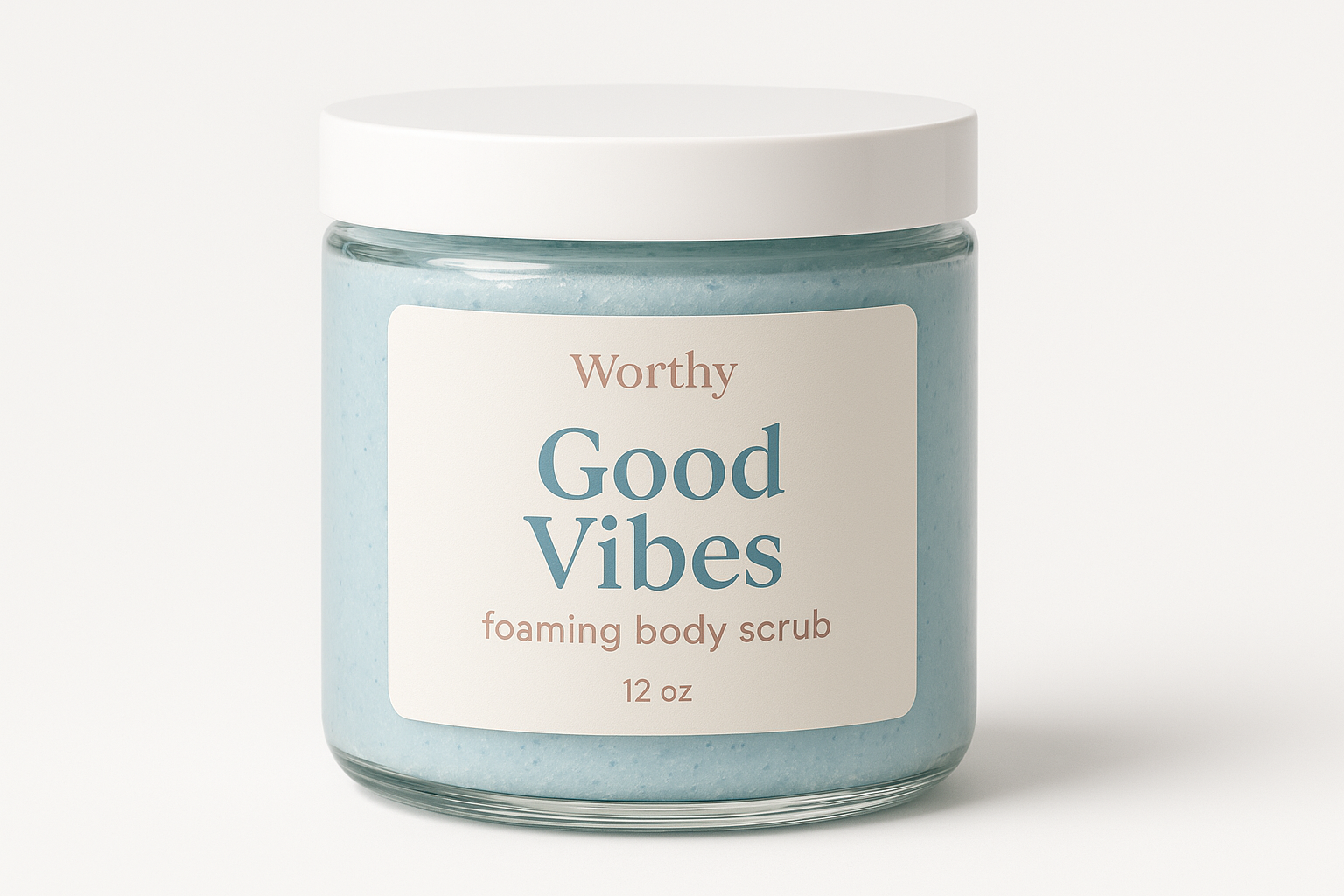 create a creamy pastel blue colored sugar body scrub in a 12oz jar with a white top. The label should say "Good Vibes" and underneath in smaller size letters it should say "foaming body scrub" also add the name "Worthy" to the top of the label