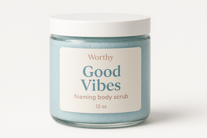 create a creamy pastel blue colored sugar body scrub in a 12oz jar with a white top. The label should say "Good Vibes" and underneath in smaller size letters it should say "foaming body scrub" also add the name "Worthy" to the top of the label