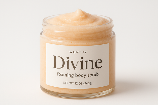 create a creamy pastel Orange colored sugar body scrub in a 12oz jar with a white top. The label should say "Divine" and underneath in smaller size letters it should say "foaming body scrub" also add the name "Worthy" to the top of the label