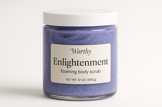 create a creamy purplish blue colored sugar body scrub in a 12oz jar with a white top. The label should say "Enlightenment" and underneath in smaller size letters it should say "foaming body scrub" also add the name "Worthy" to the top of the label
